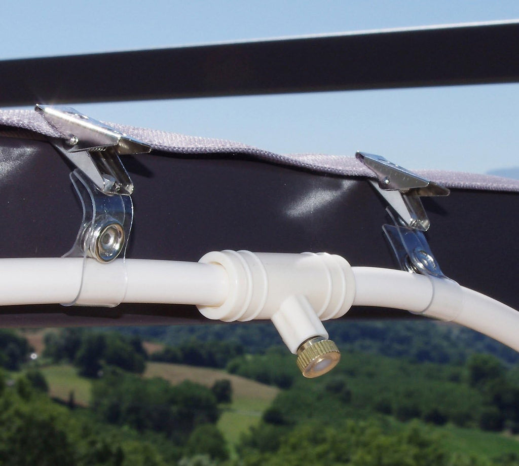 Spray irrigation system – Water hose with spray nozzles for refreshing cooling in the garden