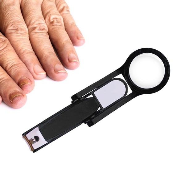 Nail clipper with magnifying glass