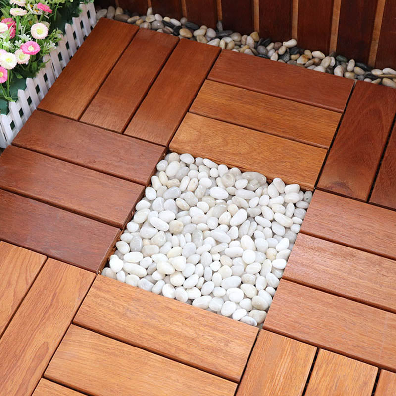 Classic wooden deck tiles connecting composite patio tiles