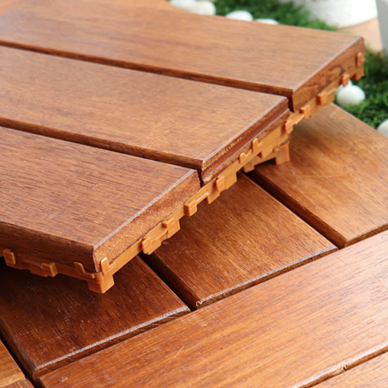 Classic wooden deck tiles connecting composite patio tiles