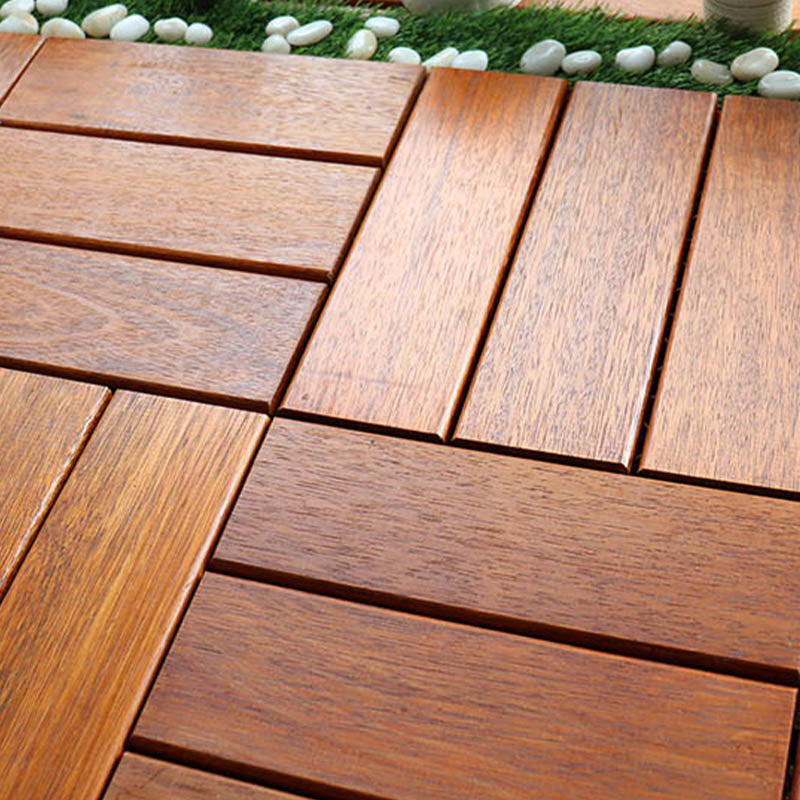 Classic wooden deck tiles connecting composite patio tiles