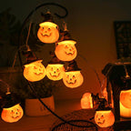 Glowing pumpkin garland Halloween with witch hats