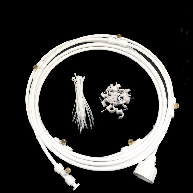 Spray irrigation system – Water hose with spray nozzles for refreshing cooling in the garden