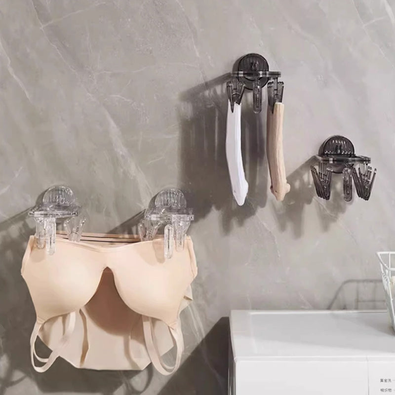 Suction cup collapsible clothes hanger with clip