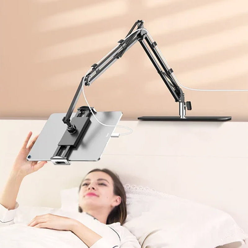 Extendable, concealed phone/tablet holder at the bed