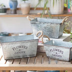 Decorative flower and garden container made of metal with hemp rope handles