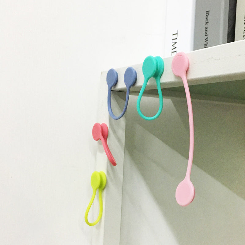 Useful magnetic cable storage holder