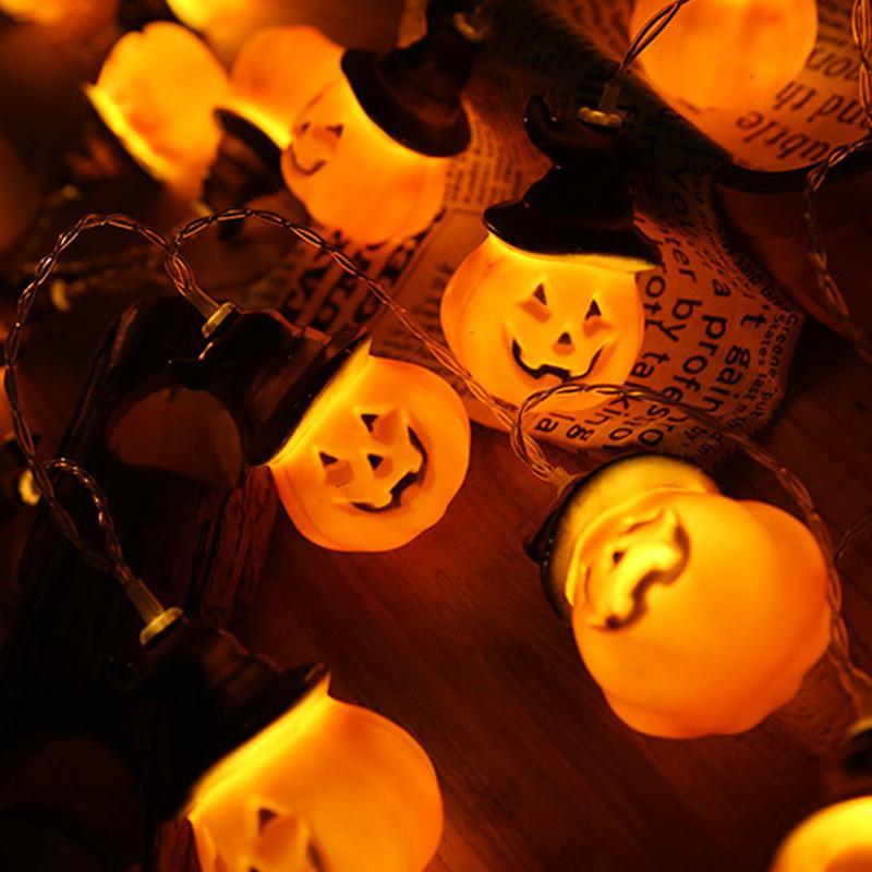 Glowing pumpkin garland Halloween with witch hats