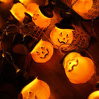 Glowing pumpkin garland Halloween with witch hats