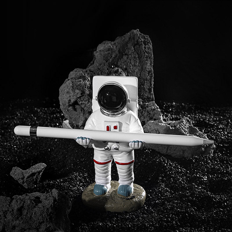 Support for phones or pens in astronaut decorations