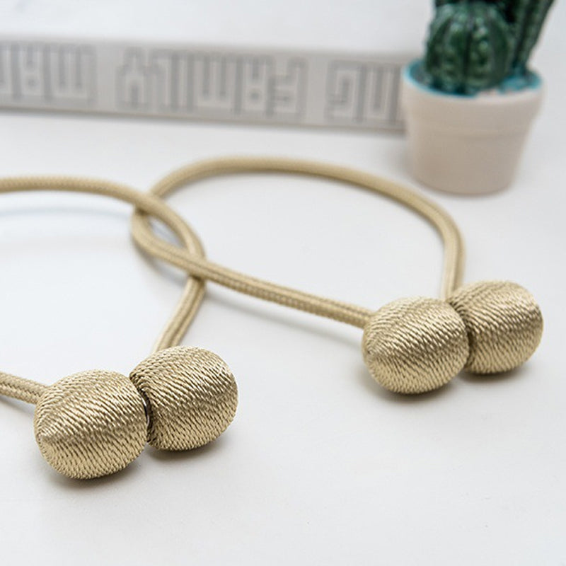 Curtain tiebacks with magnetic curtain clasp