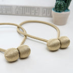 Curtain tiebacks with magnetic curtain clasp
