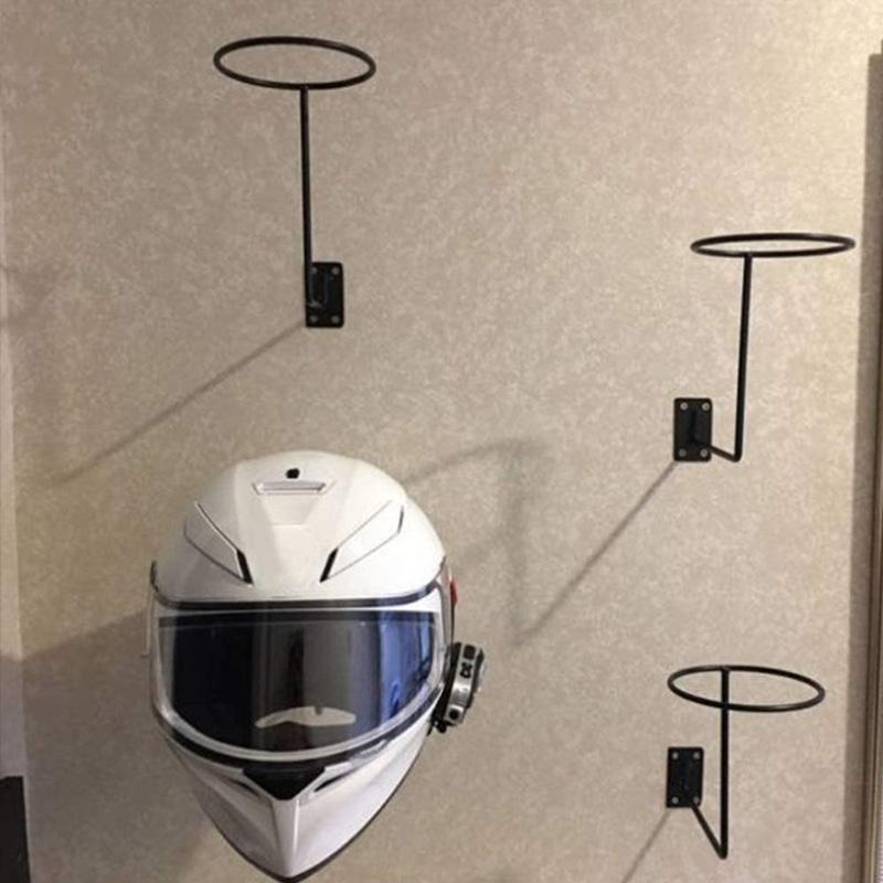 Wall-mounted helmet holder