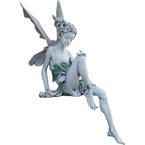 Statue of sitting fairy in the garden