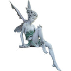 Statue of sitting fairy in the garden