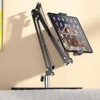 Extendable, concealed phone/tablet holder at the bed