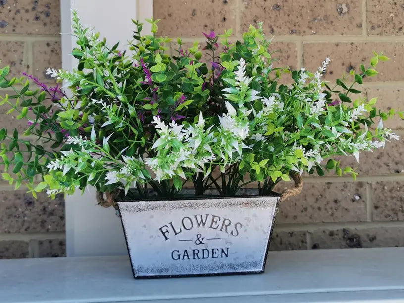 Decorative flower and garden container made of metal with hemp rope handles