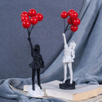 Sculpture of a girl with balloon in Banksy style for table decoration and creative living room decoration