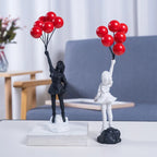Sculpture of a girl with balloon in Banksy style for table decoration and creative living room decoration