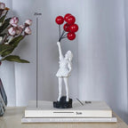 Banksy flying Balloon Girl Statue