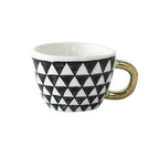 Cup with abstract geometric pattern and gold handle