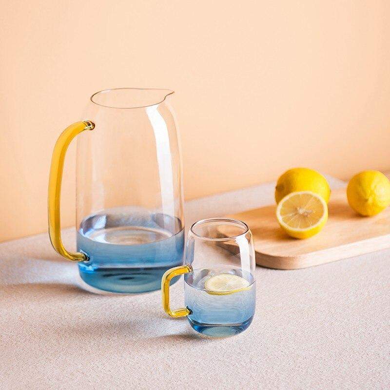 Blue glass pitcher with matching drinking glass