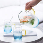 Blue glass pitcher with matching drinking glass