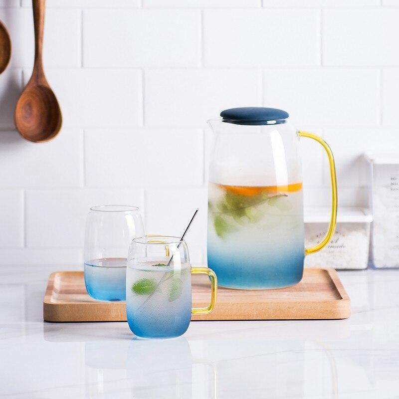 Blue glass pitcher with matching drinking glass