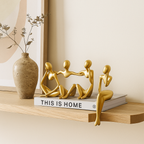 Golden abstract thinker statues in unique artistic positions