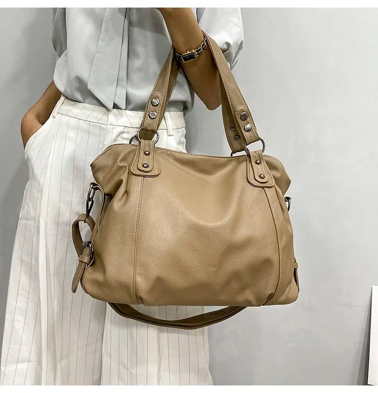 Retro-inspired tote bag with smooth faux leather and classic seam detailing