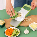 Vegetable slicer and grater with 6 blades made of stainless steel and safety device