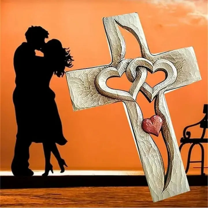 Hand-carved wooden cross with intertwined hearts