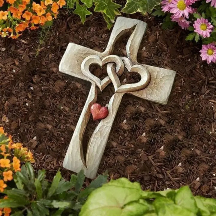 Hand-carved wooden cross with intertwined hearts