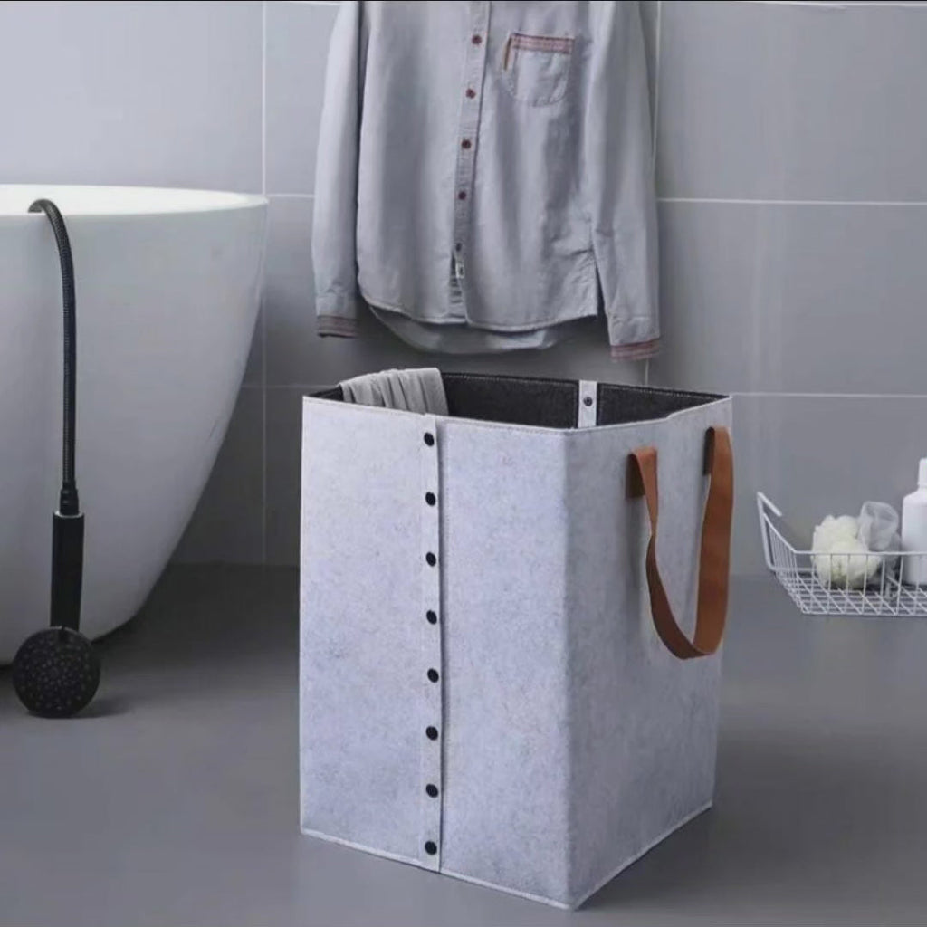 Collapsible laundry basket with leather handles