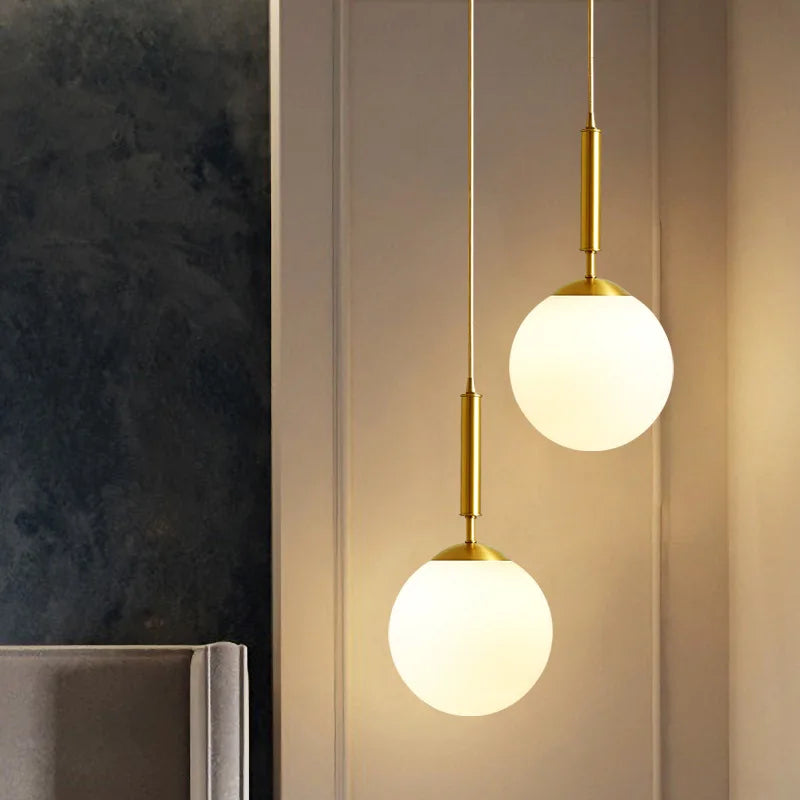 Luxurious pendant lamp in gold – Modern hanging light for staircase or living area