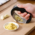 Durable garlic press made of stainless steel for effortless crushing