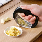 Durable garlic press made of stainless steel for effortless crushing