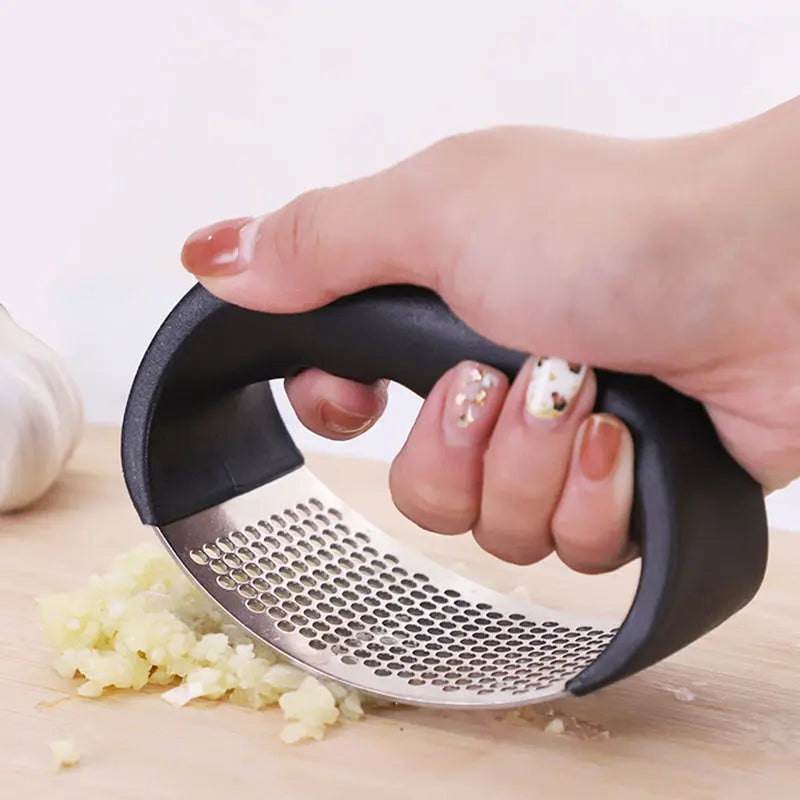 Durable garlic press made of stainless steel for effortless crushing