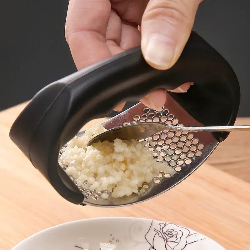 Durable garlic press made of stainless steel for effortless crushing