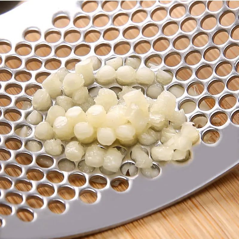 Durable garlic press made of stainless steel for effortless crushing