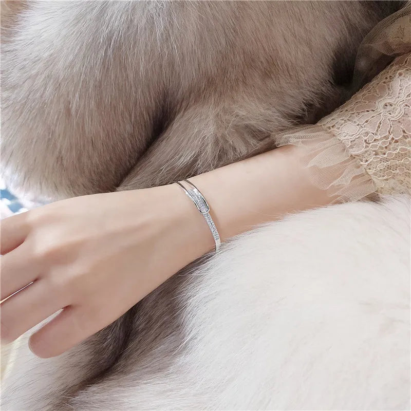 Open bracelet made of 925 sterling silver with zirconia