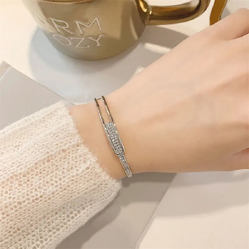 Open bracelet made of 925 sterling silver with zirconia