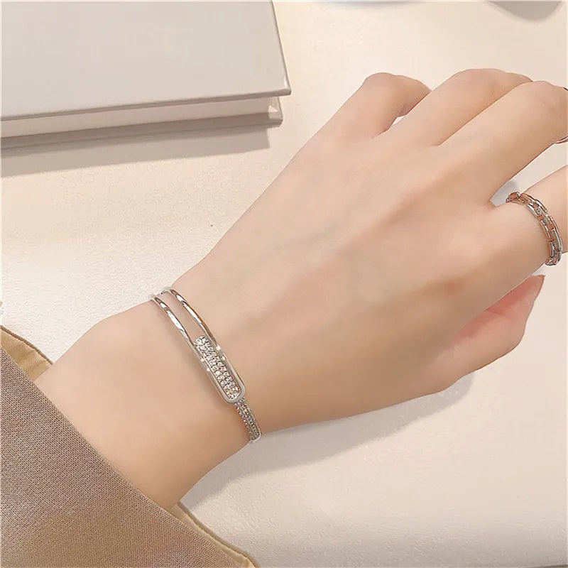 Open bracelet made of 925 sterling silver with zirconia