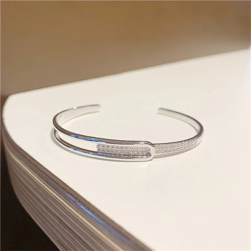 Open bracelet made of 925 sterling silver with zirconia