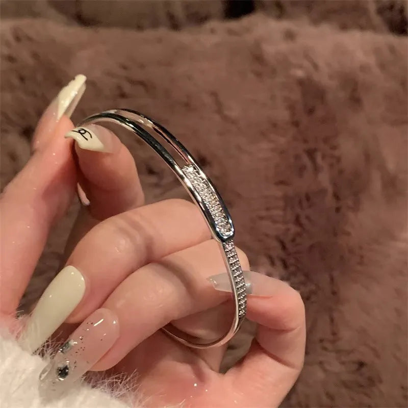 Open bracelet made of 925 sterling silver with zirconia