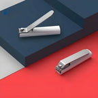 Nail clipper with file and splash guard