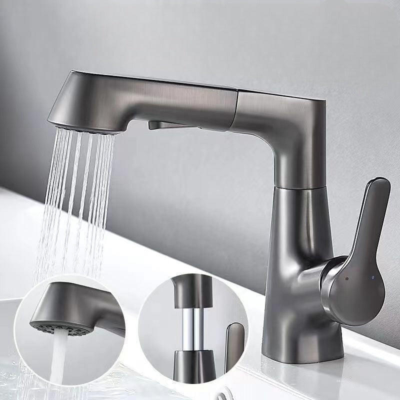 Bathroom fixture with rotating retractable hand shower