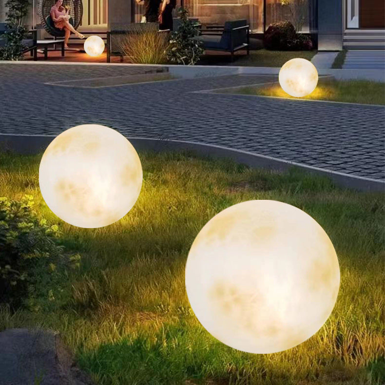 Solar-powered garden lamp with moon design