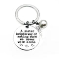 A sister is God's way of making sure we never walk alone keychain