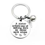 A sister is God's way of making sure we never walk alone keychain